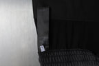 Black sweatpants with side seam panel and interior care label tag