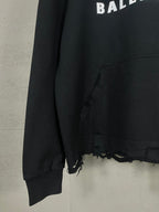 Black long hoodie sleeve and front seam with frayed hem edging