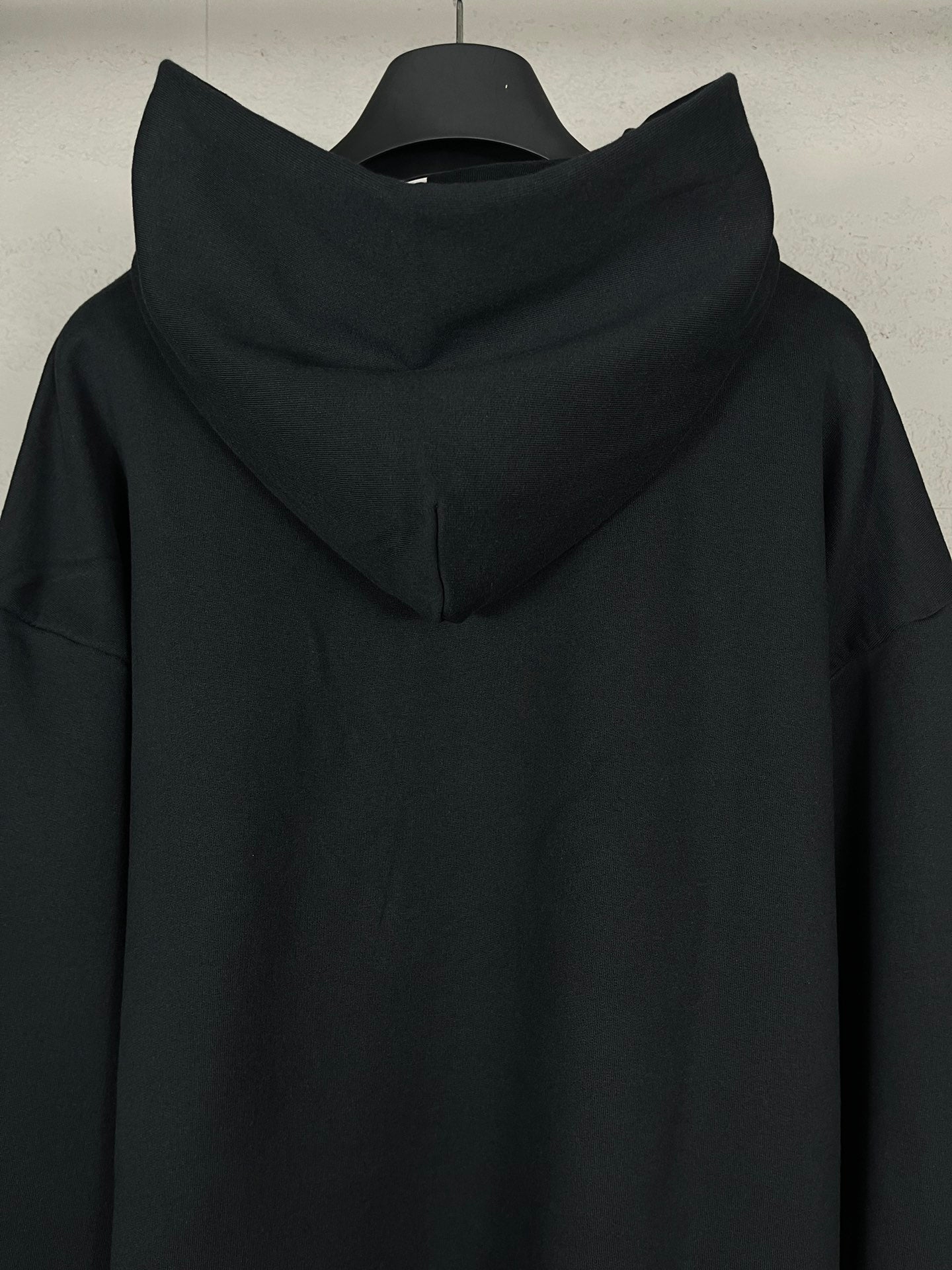 Balenciaga long black hoodie with folded hood and clean back yoke