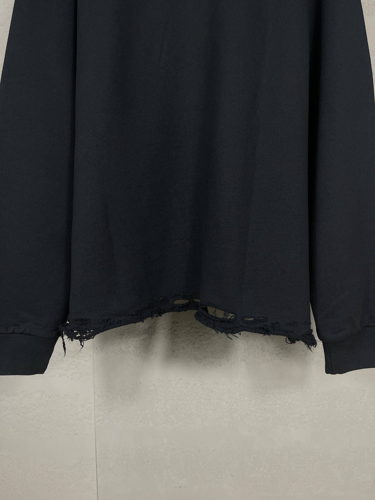 Black long hoodie back hem with distressed frayed edge