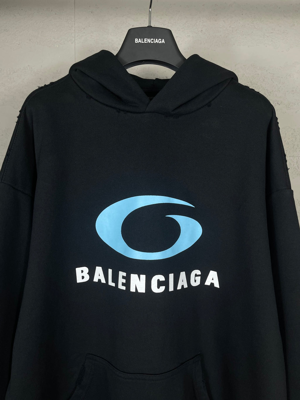 Black long hoodie with blue logo graphic and BALENCIAGA lettering