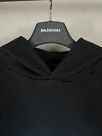Black long hoodie with oversized hood and ribbed neckline detail