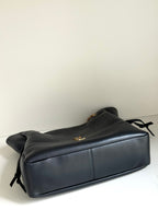 YSL duffel bag in dark navy leather with top flap and gold chain hardware