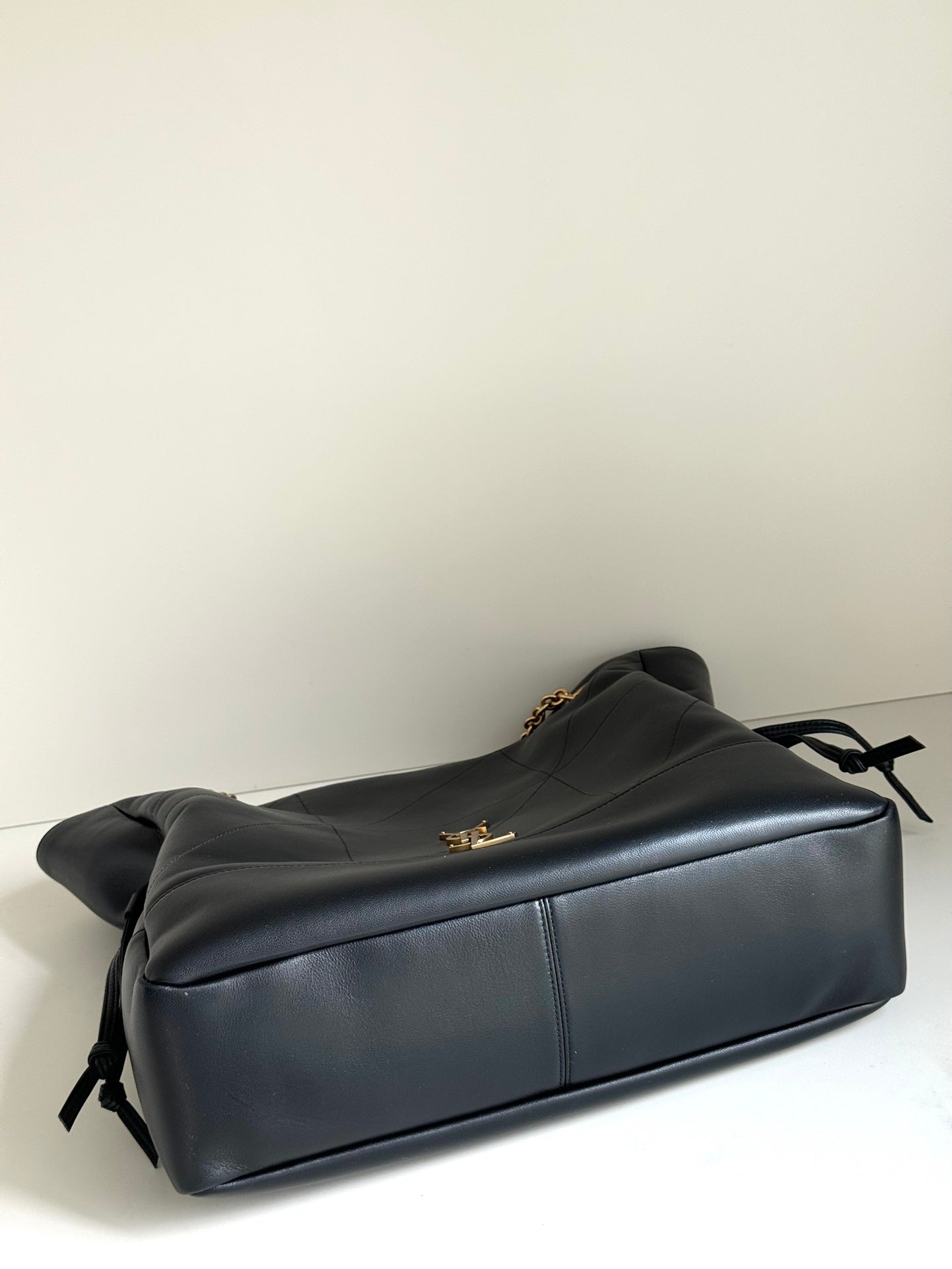 YSL duffel bag in dark navy leather with top flap and gold chain hardware