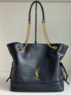 YSL tote bag in dark navy leather with gold chain straps and YSL logo front