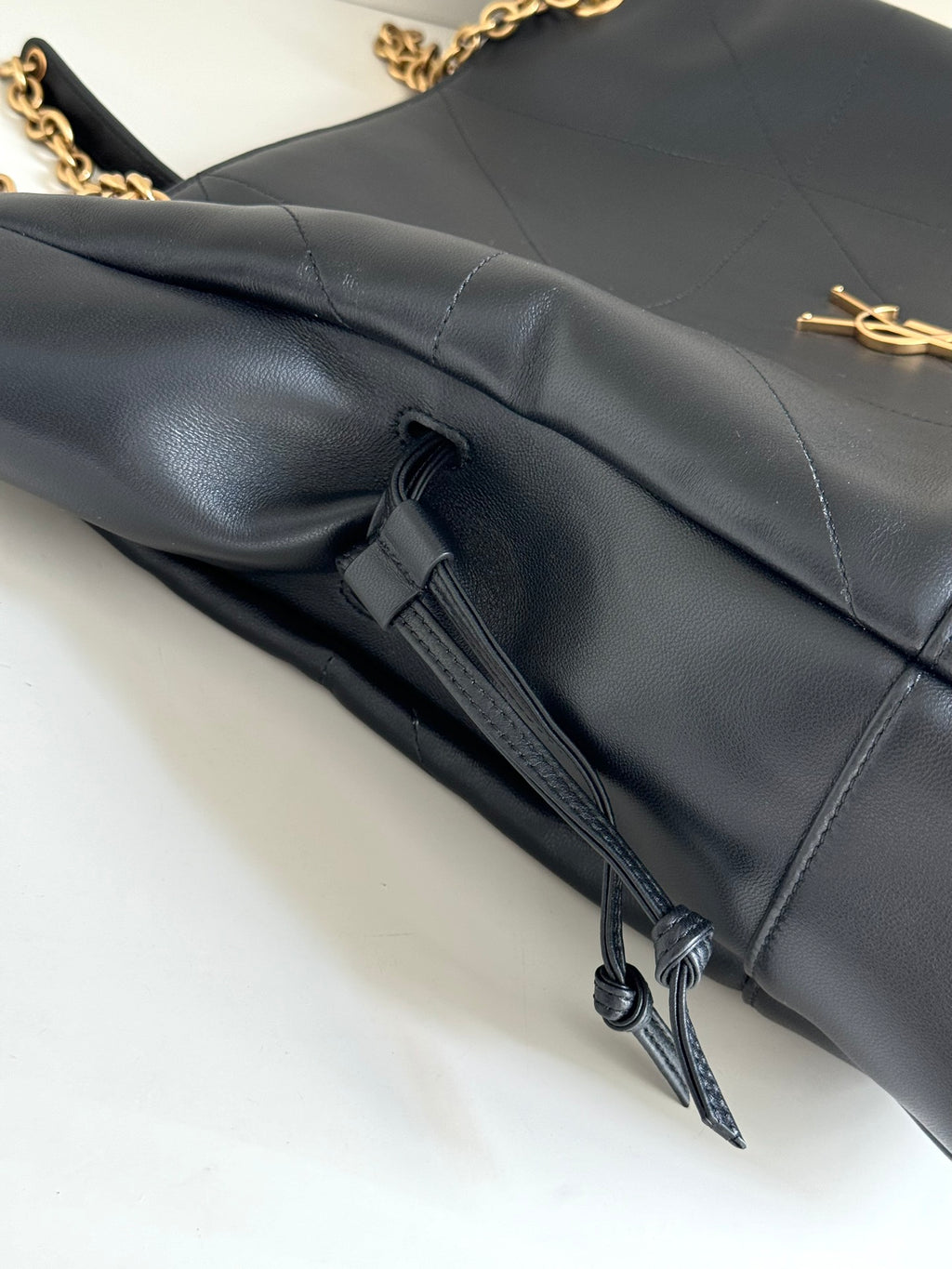 YSL duffel bag in dark navy leather with zipper pull and gold logo accents