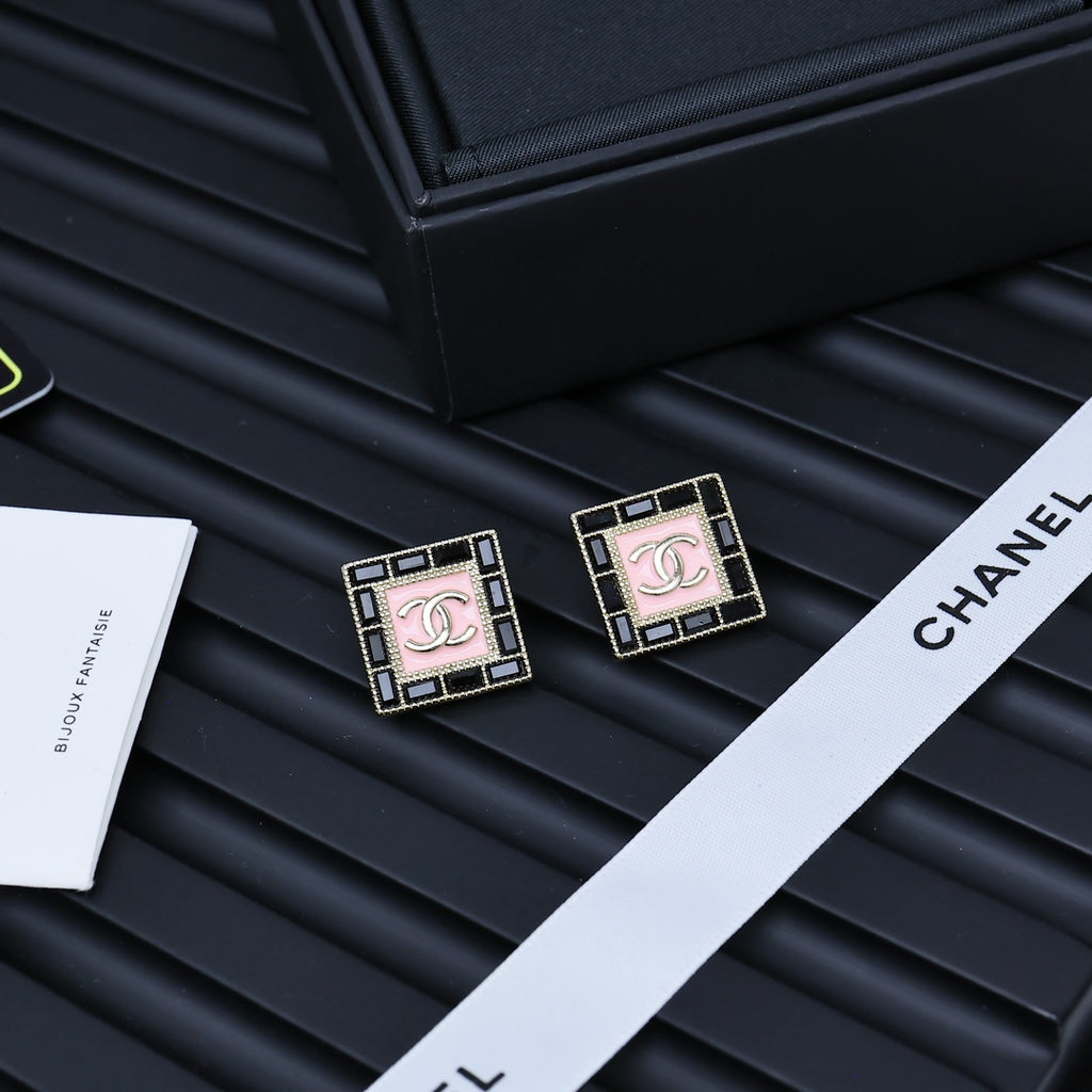 Pair of square Chanel logo stud earrings with pink enamel panels and gold-tone trim