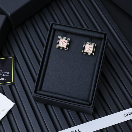 Square Chanel logo stud earrings with pink enamel center and gold-tone frame