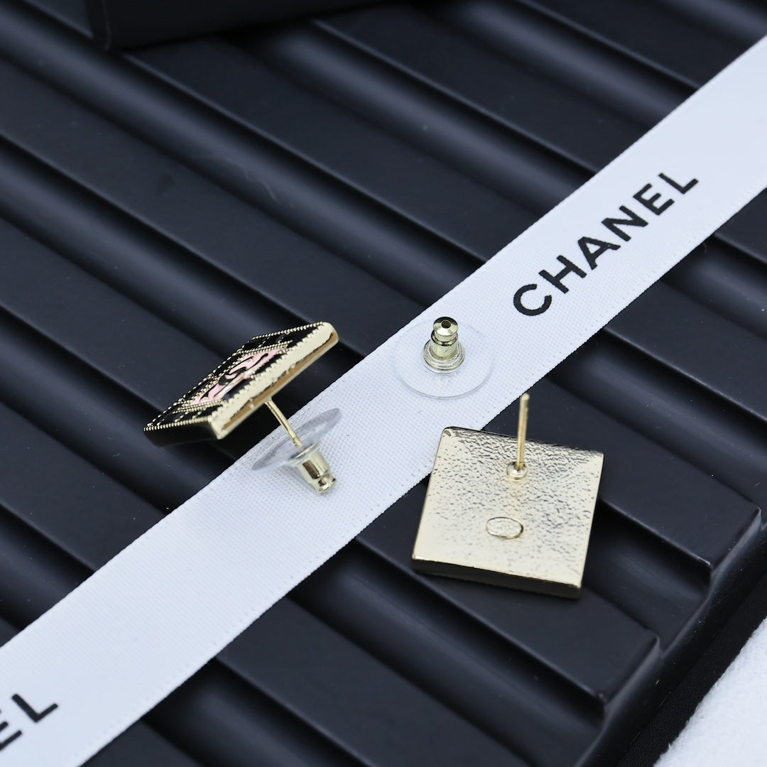 Square Chanel logo stud earrings with gold-tone backing and circular post
