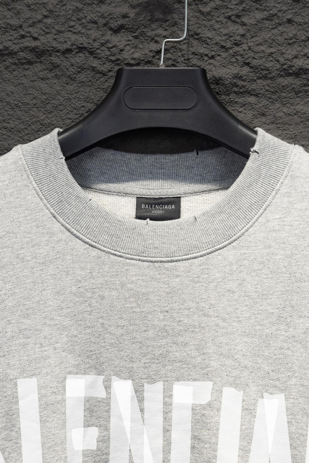 Balenciaga crewneck sweatshirt neckline close-up with ribbed collar and logo