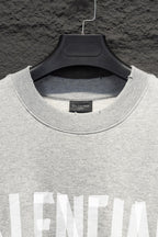 Balenciaga crewneck sweatshirt neckline close-up with ribbed collar and logo