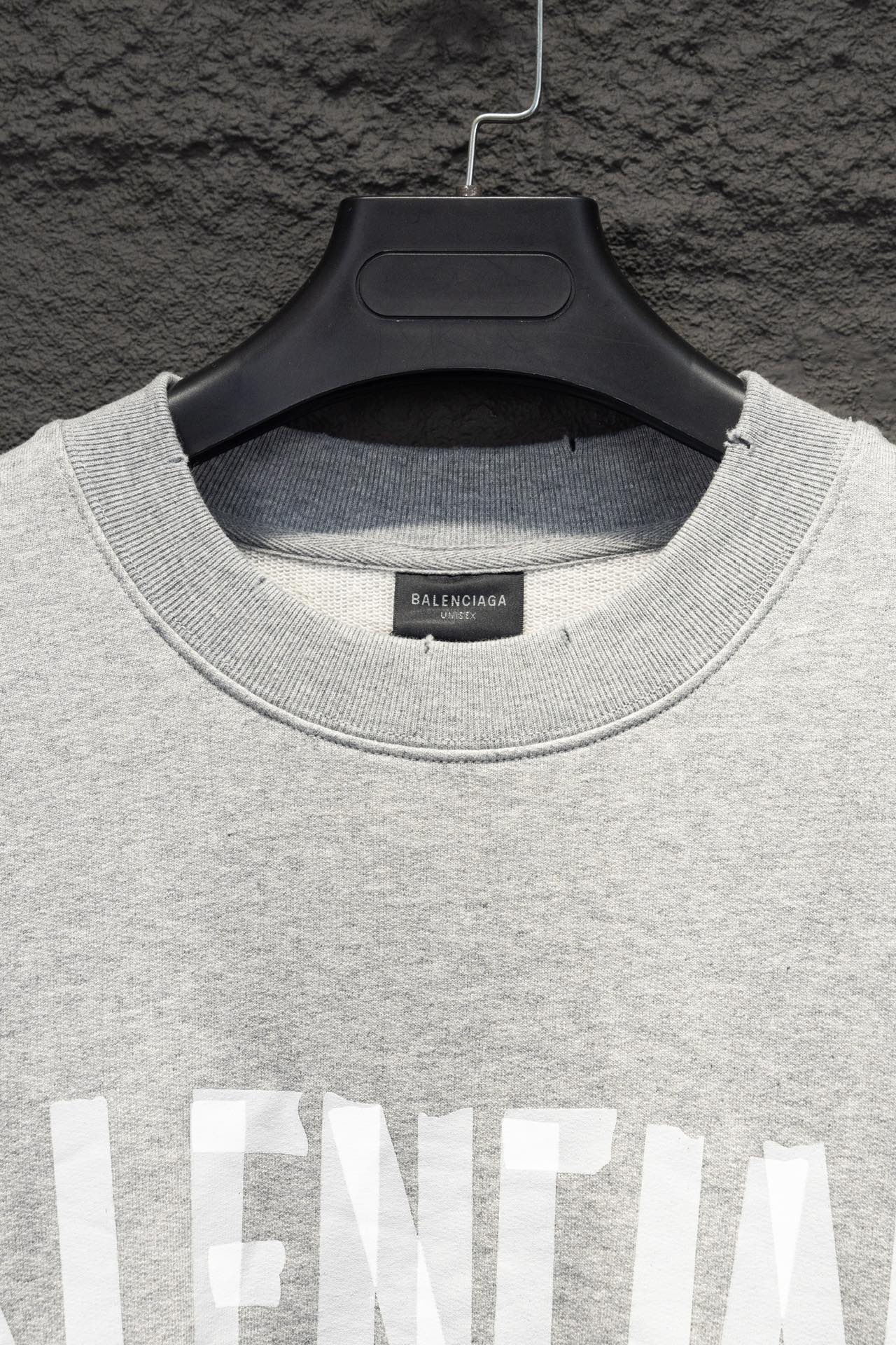 Balenciaga crewneck sweatshirt neckline close-up with ribbed collar and logo