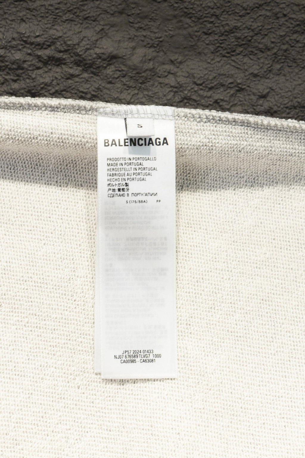 Balenciaga size label on sweatshirt inner collar, showing brand name