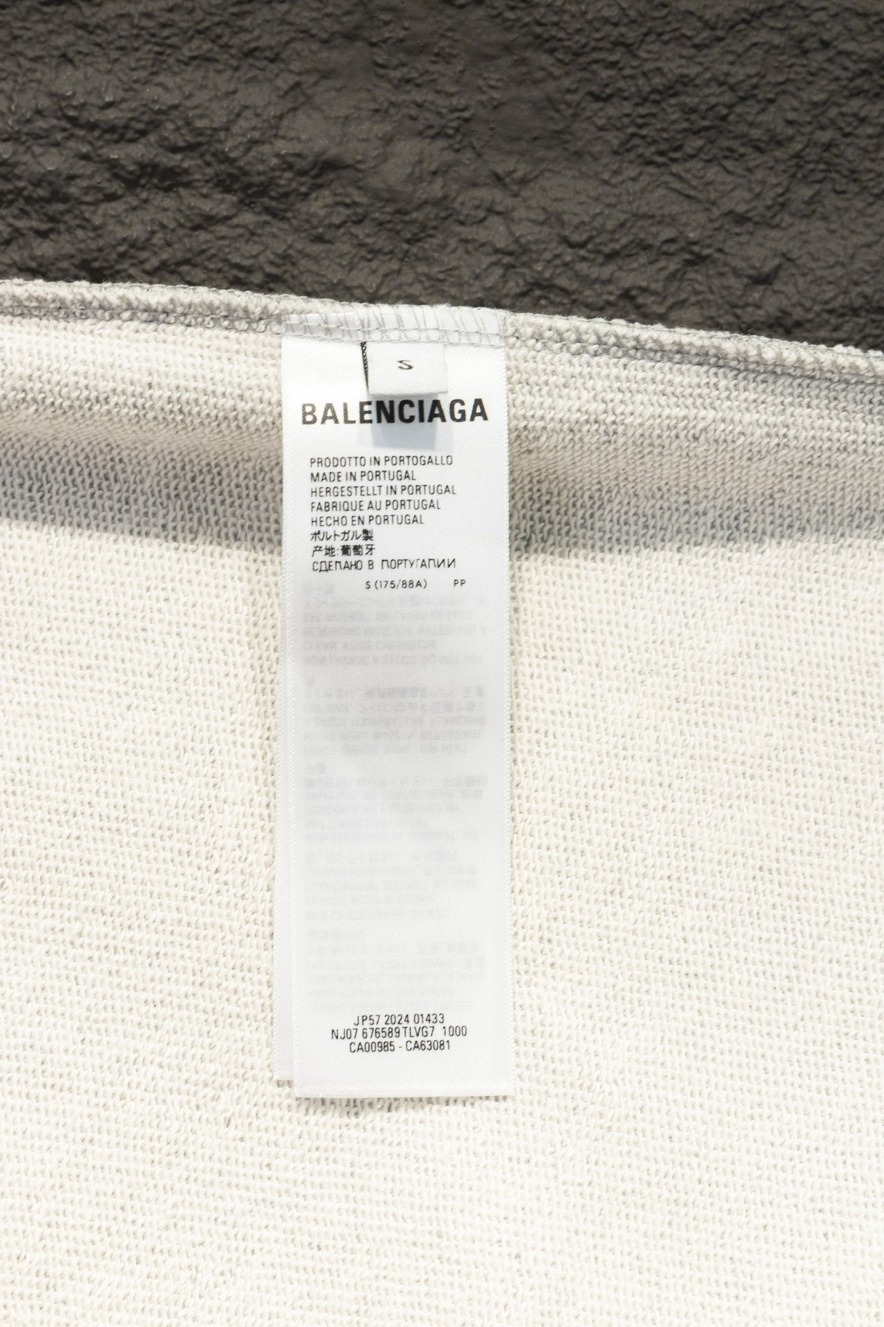 Balenciaga size label on sweatshirt inner collar, showing brand name