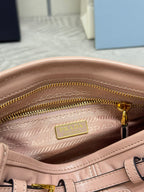 Pink leather bag interior with Prada logo label and twin gold-tone zipper tracks