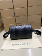 Monogram canvas bag with front strap detailing and shoulder strap
