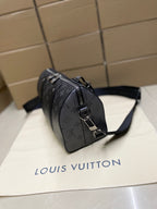 Monogram canvas crossbody bag, side view with shoulder strap