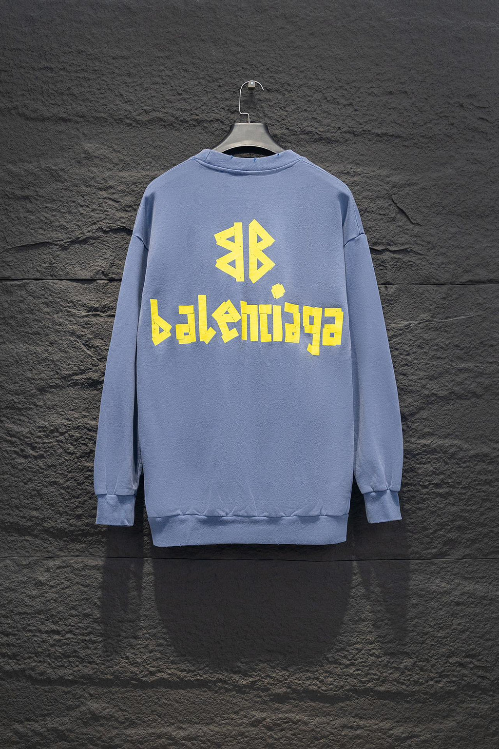 Light blue sweatshirt, crewneck, long sleeves, ribbed cuffs, Balenciaga logo back.