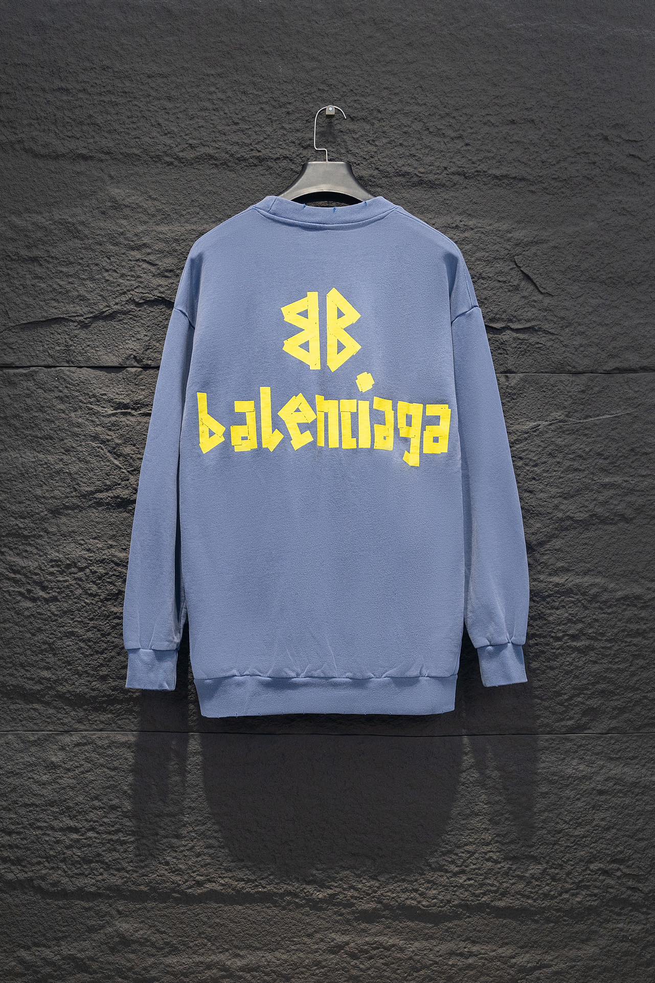 Light blue sweatshirt, crewneck, long sleeves, ribbed cuffs, Balenciaga logo back.