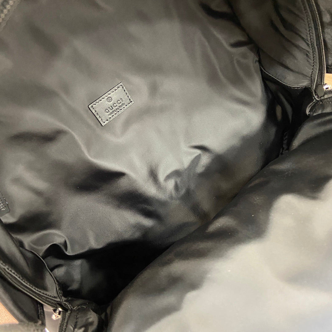 Gucci men’s backpack interior lining with small square Gucci label