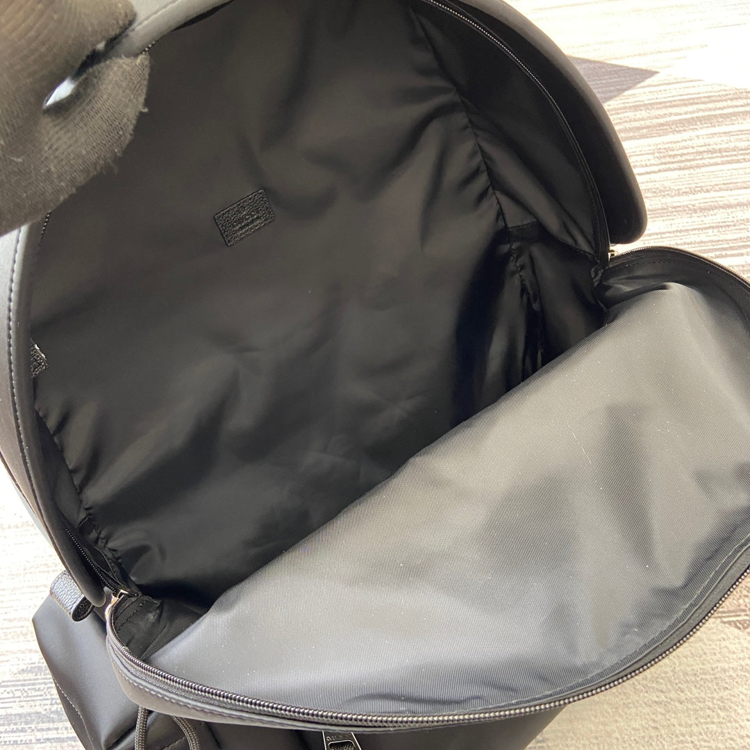 Gucci black backpack interior lining with zip opening and stitched seam