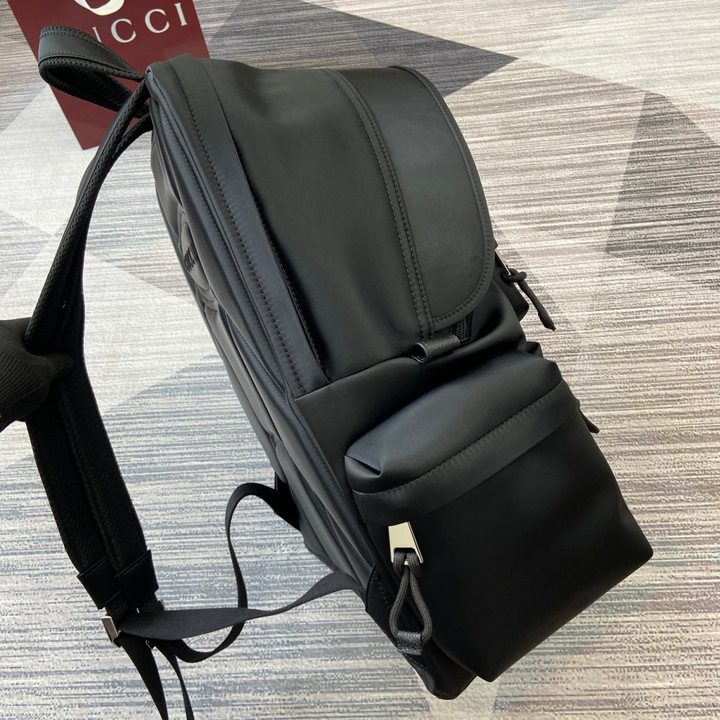 Gucci black backpack side with adjustable strap and front utility pocket