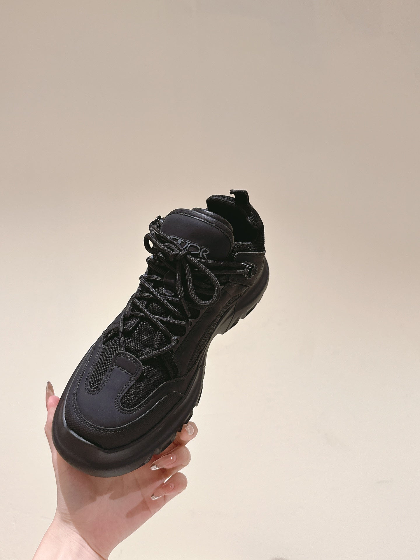 Dior unisex black sneaker profile, lace-up with logo patch and rubber outsole