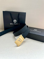 Versace belt with dark blue strap and gold-tone square VJ logo buckle