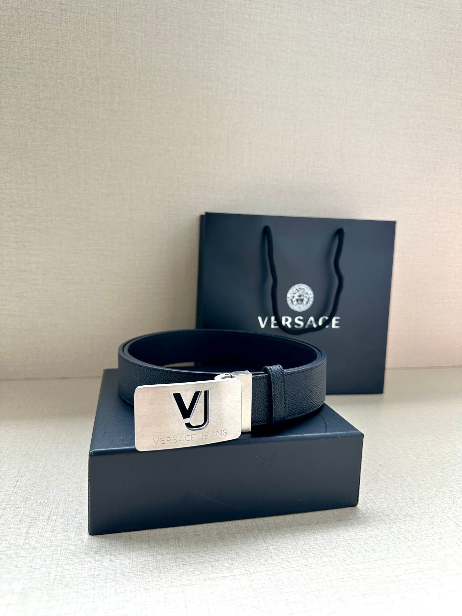 Dark blue Versace belt with square silver-tone VJ logo buckle