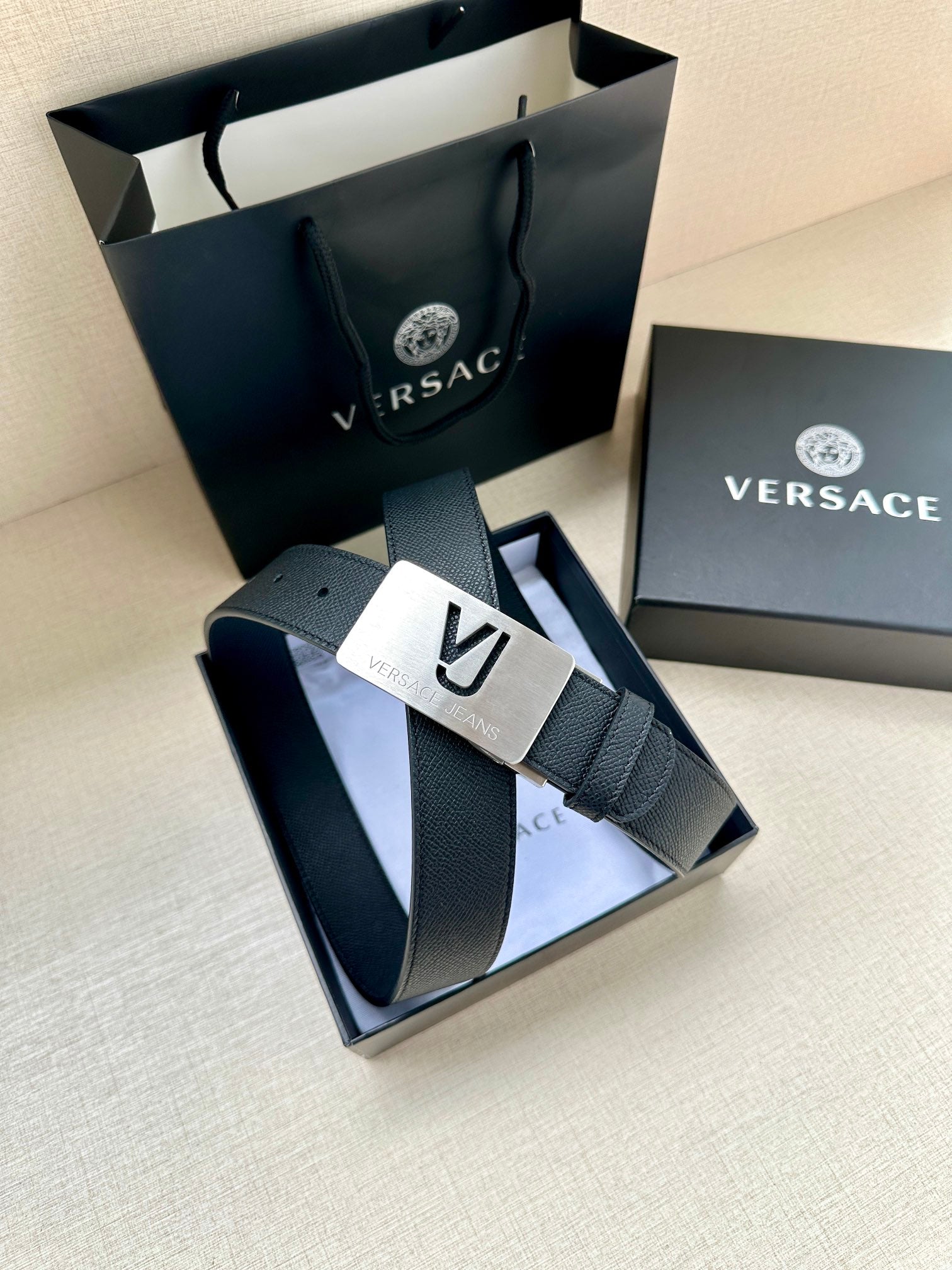 Dark blue leather belt with square metal VJ logo buckle in gift box