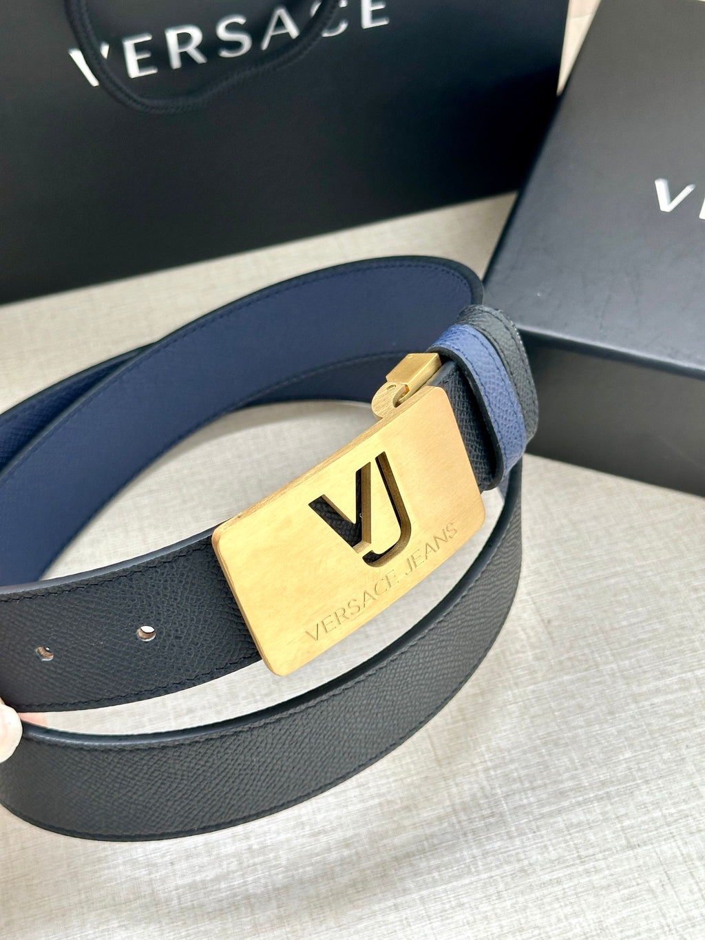 Versace blue leather belt with gold buckle plate and silver logo engraving