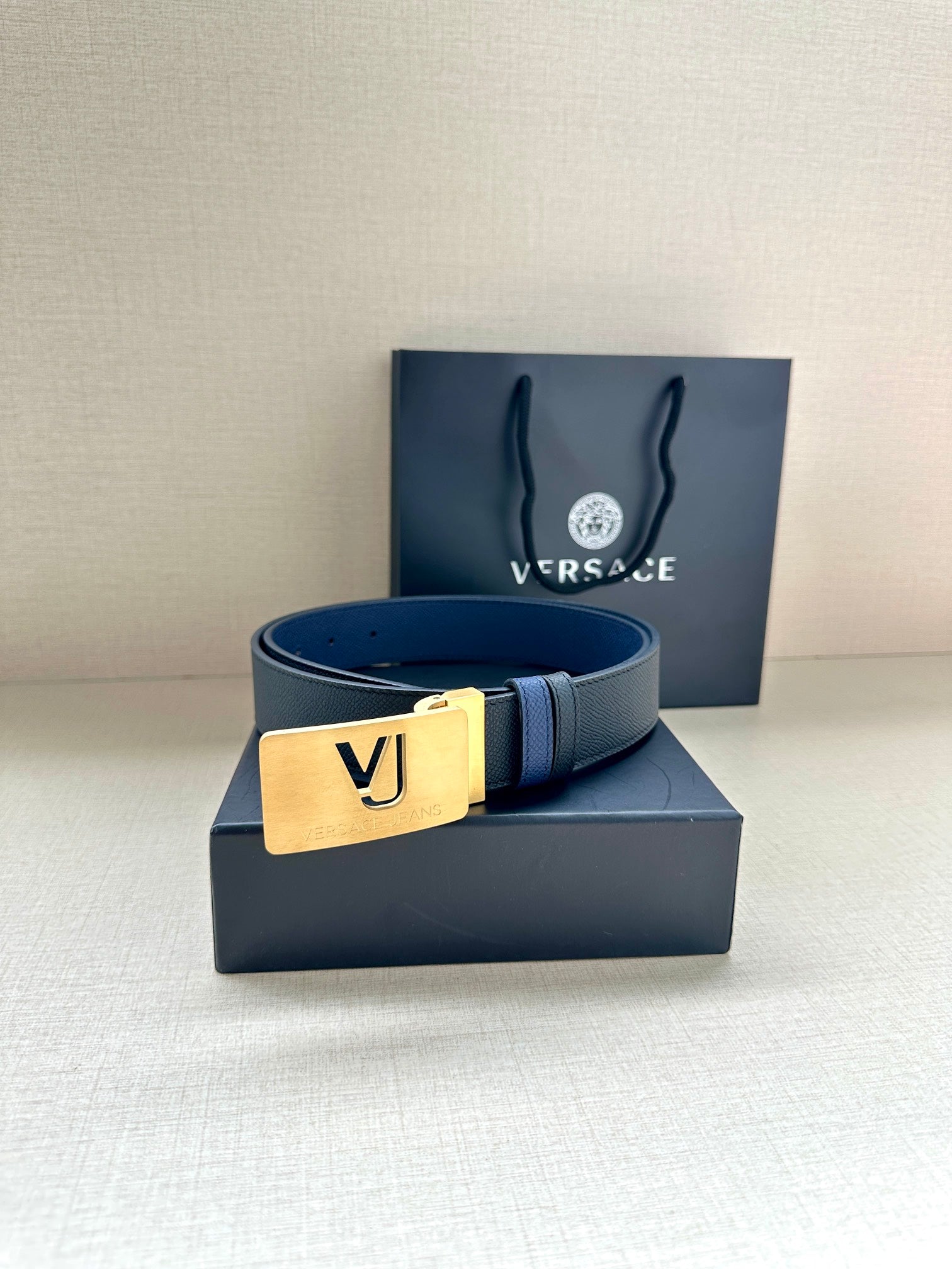 Versace blue leather belt with gold square buckle and engraved logo plate