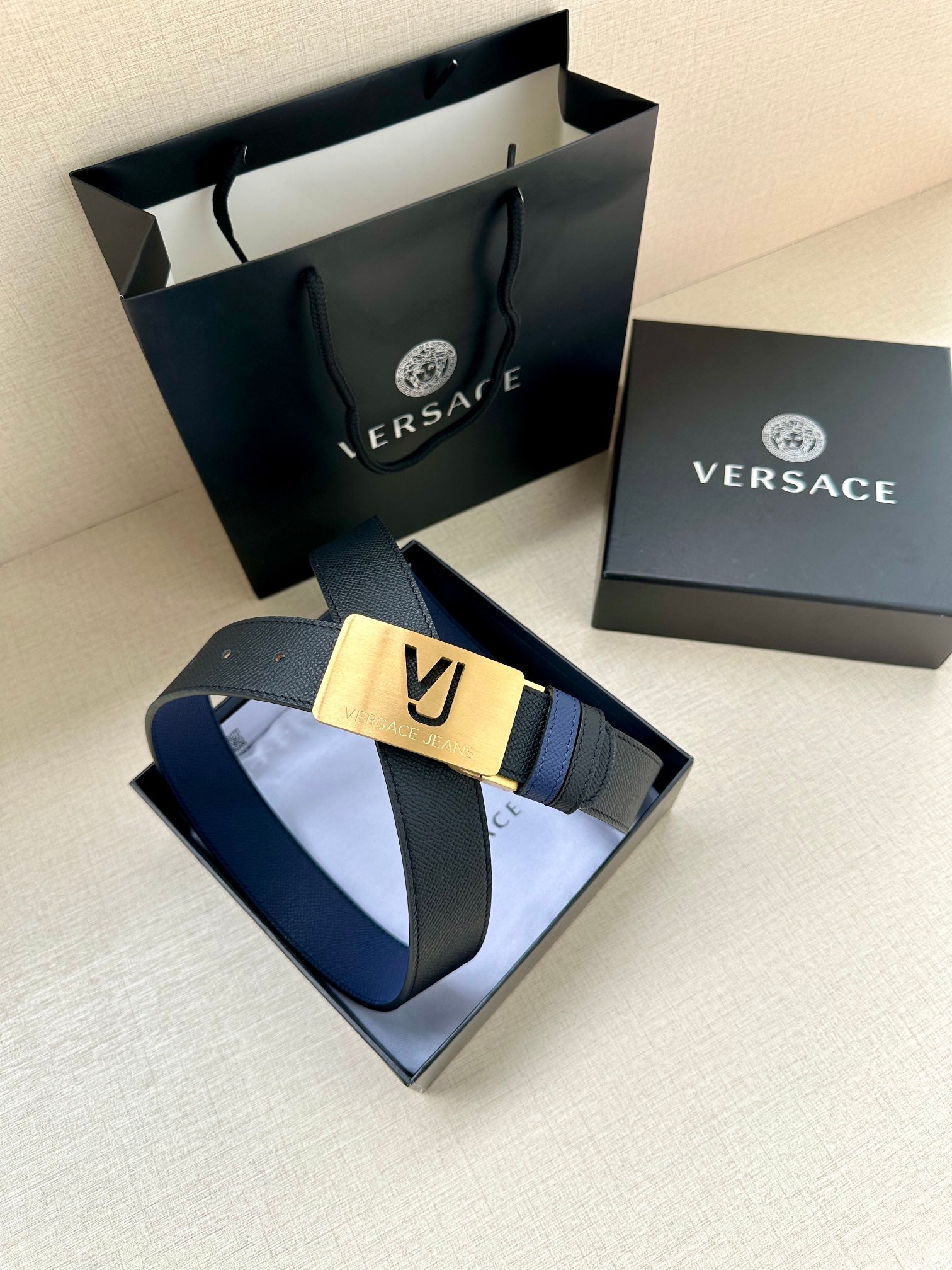 Versace blue leather belt with gold square buckle plate and stitched strap edge