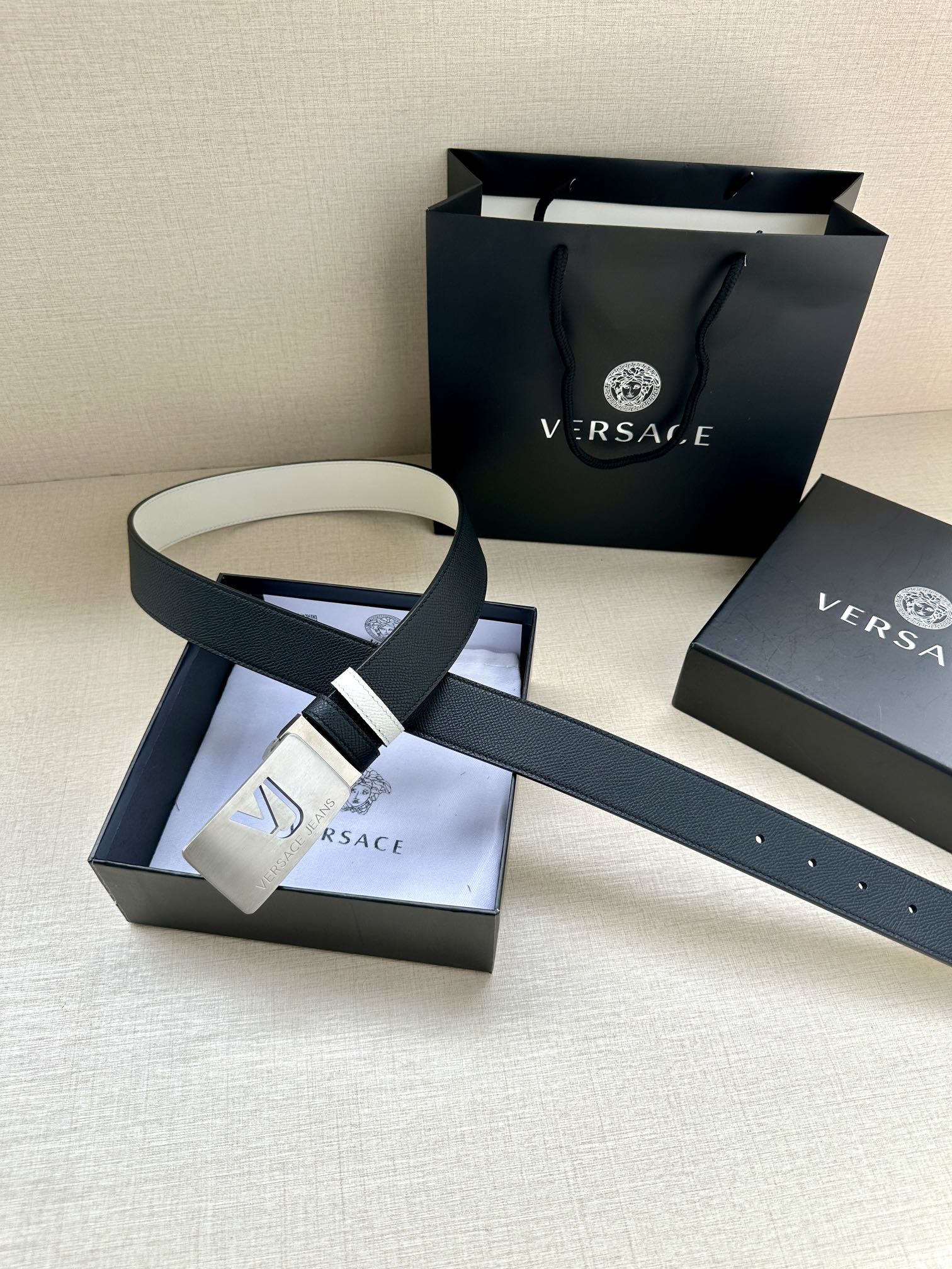 Versace belt with dark leather and white stripes, gold square VJ buckle