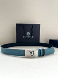 Two-tone leather belt with turquoise strap, silver metal buckle, and logo studs