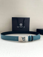 Two-tone leather belt with turquoise strap, silver metal buckle, and logo studs