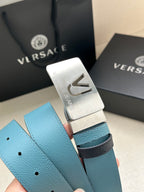 Silver belt buckle with VJ engraving on turquoise pebbled leather strap with holes