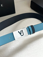Two-tone leather belt with turquoise strap and silver square VJ logo buckle