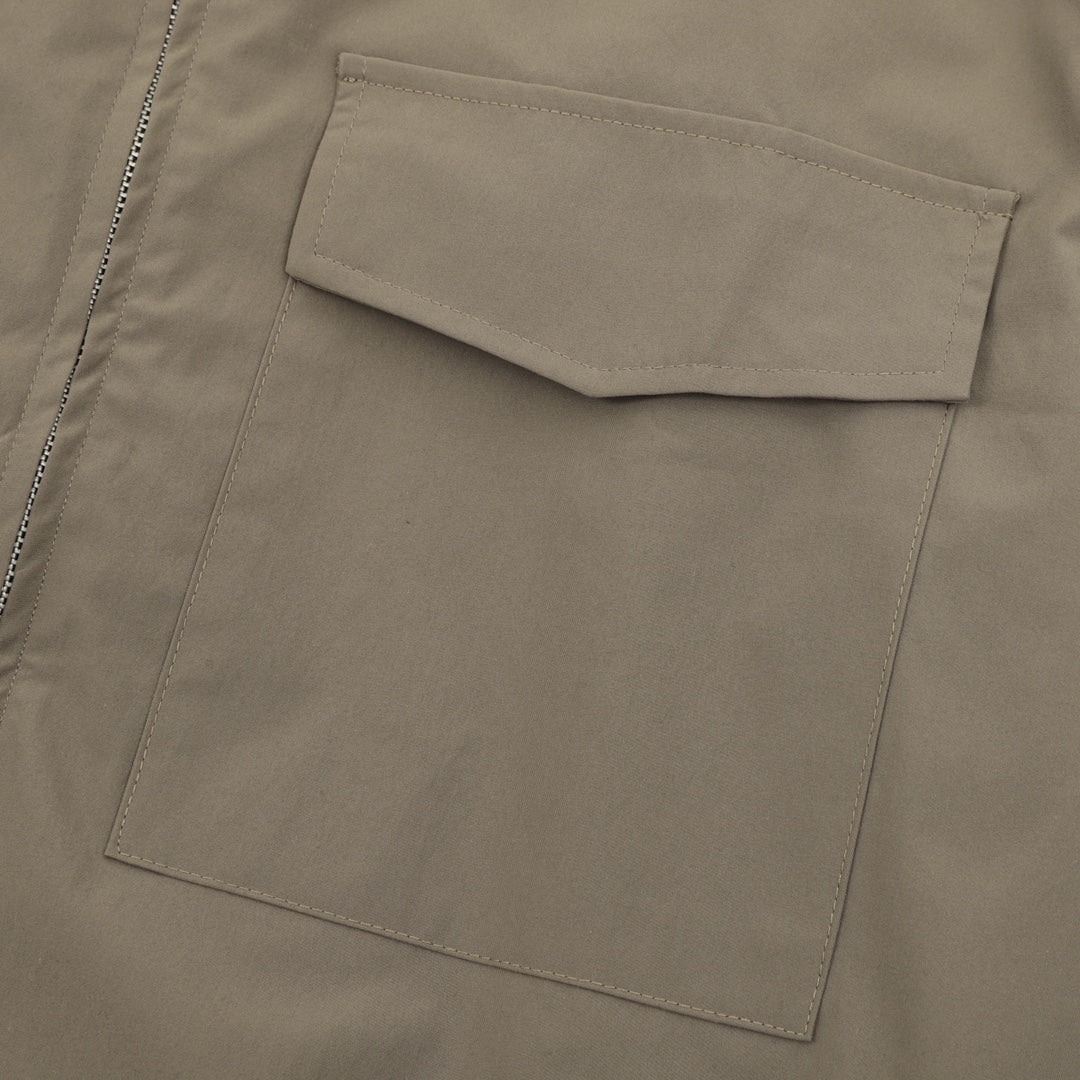 Stone Island bomber jacket chest pocket detail in olive with contrast stitching