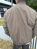 Stone Island taupe jacket back view with elastic waistband