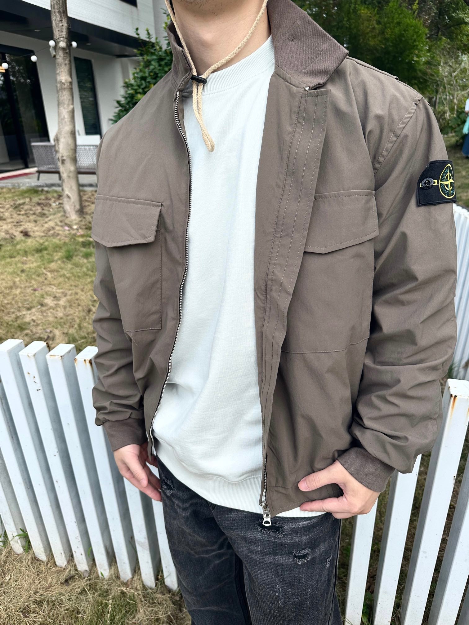 Stone Island taupe jacket with chest pockets and sleeve patch