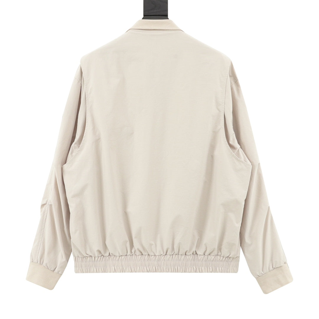 Light beige zip-up jacket back view with elasticated hem and cuffs.