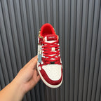 Red and white Amiri sneakers with red lining and logo heel label