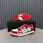 Red Amiri sneakers with textured sole and leopard-and-white upper