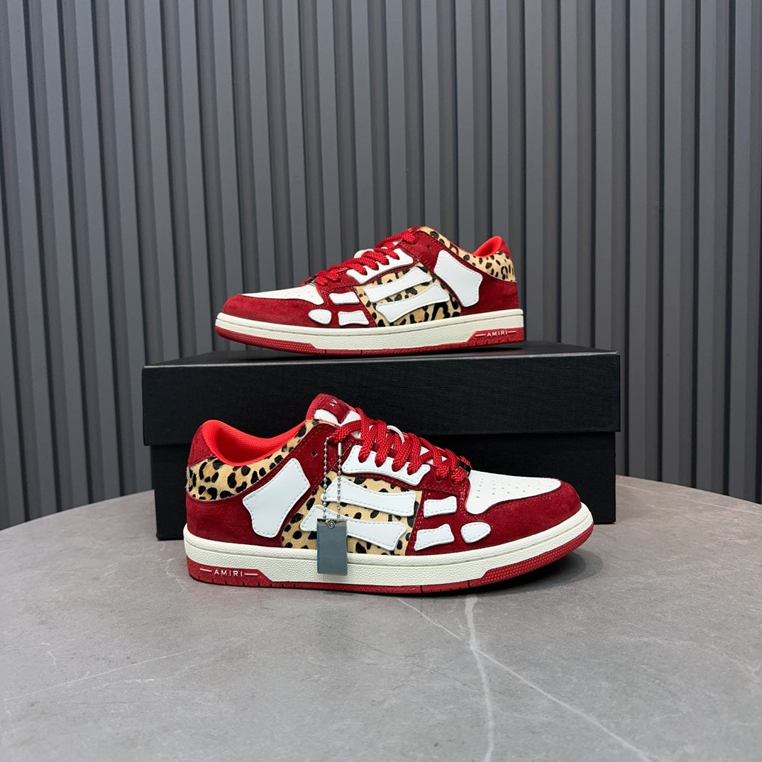 Red and white Amiri sneakers with leopard print and white strap detail