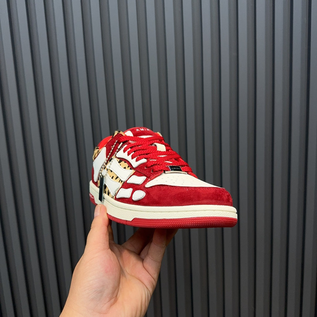 Red, white, and leopard-print Amiri sneakers, side profile
