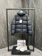 Long quilted puffer jacket with hood, dark navy/black, button front and logo patch