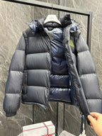 Long hooded puffer jacket with open hood and blue inner detail, quilted dark front