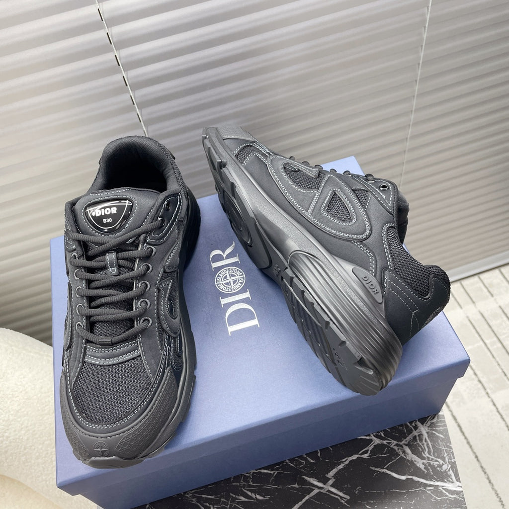 Dior unisex sneakers dark gray, side view with sculpted sole and logo detailing.