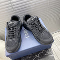 Dior unisex sneakers in dark gray with lace-up front and padded collar.